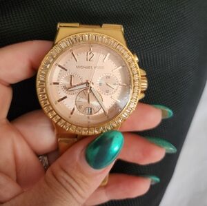 Used Michael korswatch.Front screen  has no scratches still has protective cover